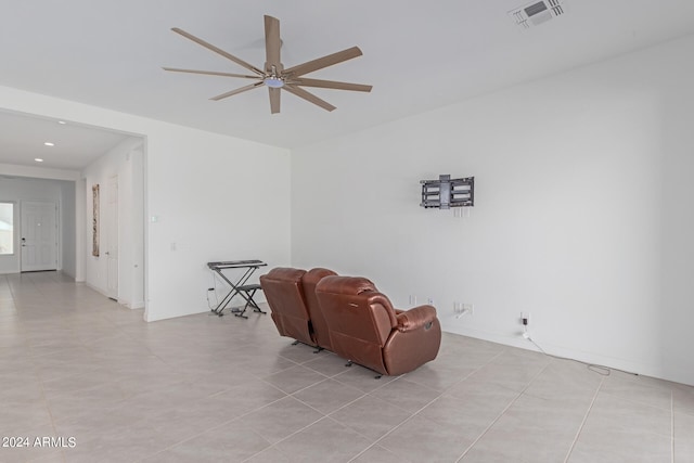 living area featuring light tile patterned flooring and ceiling fan