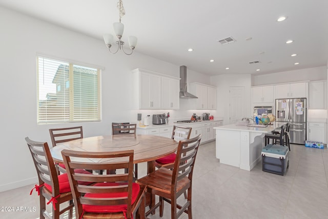 dining space featuring an inviting chandelier and light tile patterned floors