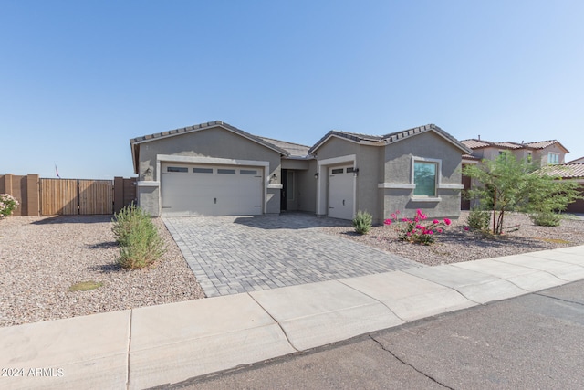 single story home featuring a garage