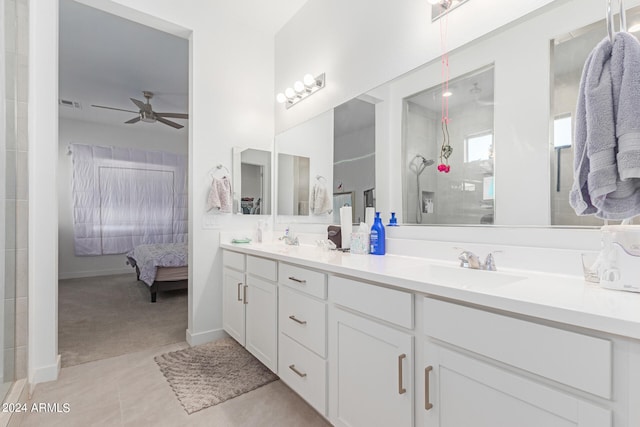 bathroom with a shower, tile patterned floors, vanity, and ceiling fan