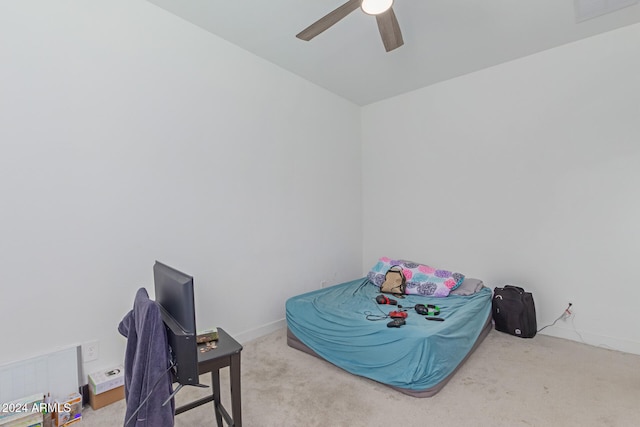 bedroom featuring ceiling fan and light colored carpet