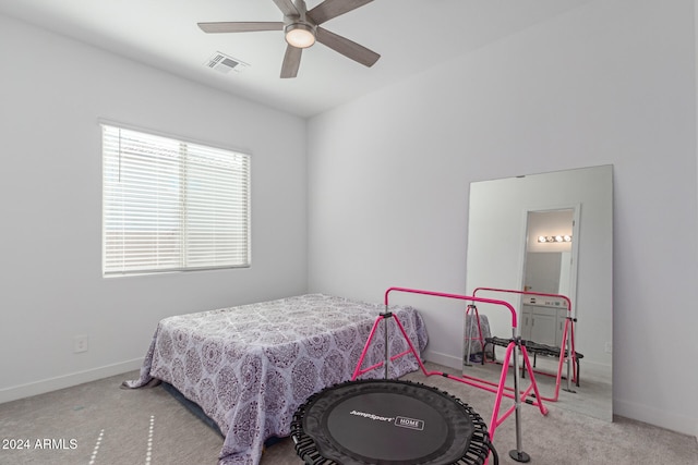 carpeted bedroom featuring ceiling fan