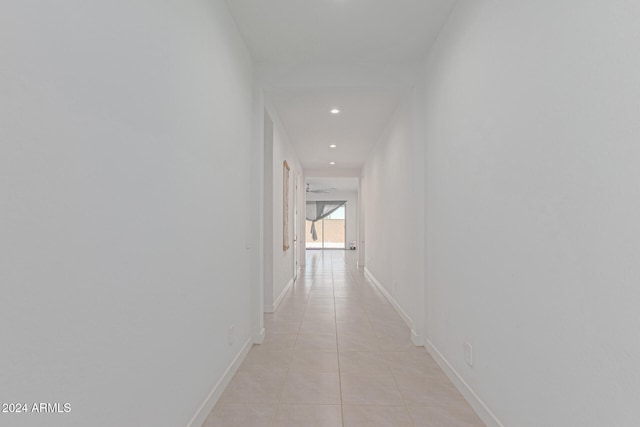 hall with light tile patterned flooring