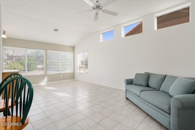 living room with vaulted ceiling, ceiling fan, and light tile floors