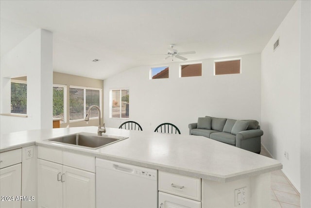 kitchen with white cabinetry, ceiling fan, sink, white dishwasher, and vaulted ceiling