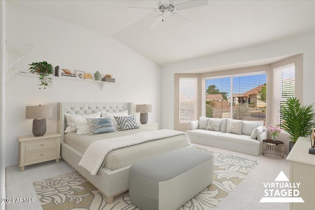 bedroom featuring ceiling fan, light carpet, and vaulted ceiling