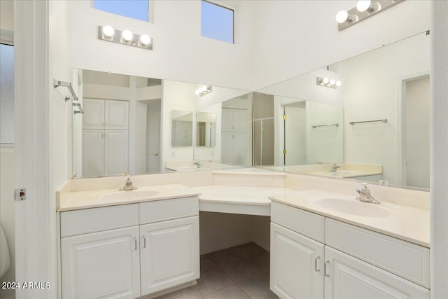 bathroom featuring dual vanity and tile flooring