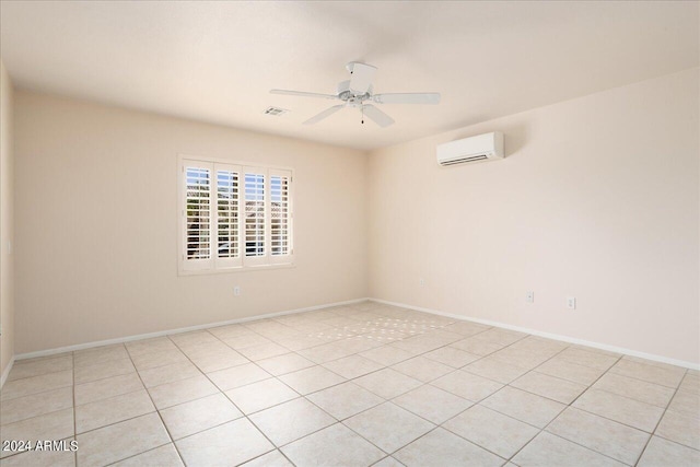 tiled empty room with a wall mounted AC and ceiling fan