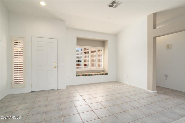 tiled entryway featuring plenty of natural light