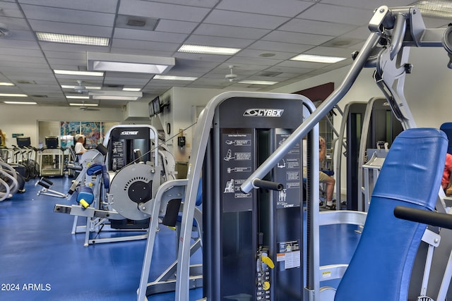 exercise room featuring a paneled ceiling