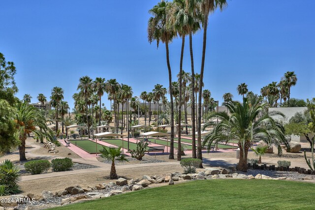 view of home's community featuring a lawn