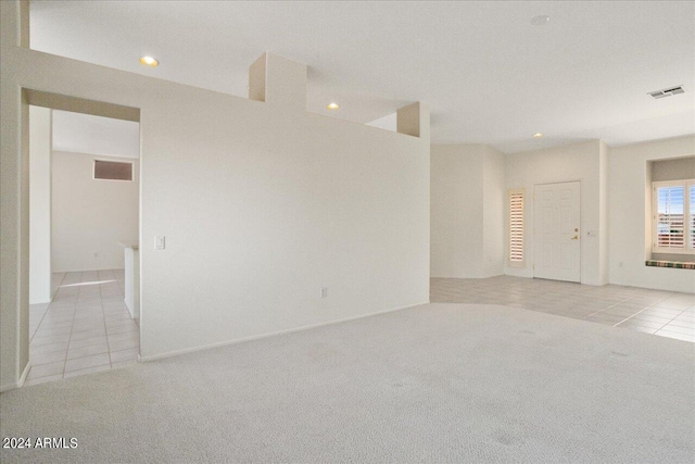 spare room featuring light tile floors