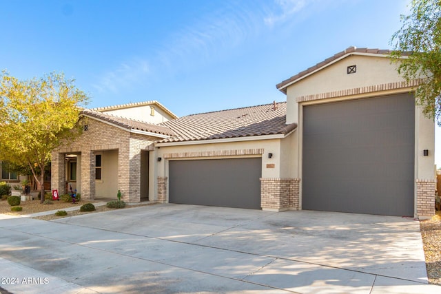 mediterranean / spanish house featuring a garage