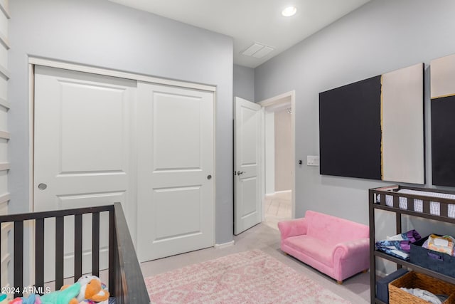 carpeted bedroom featuring a closet