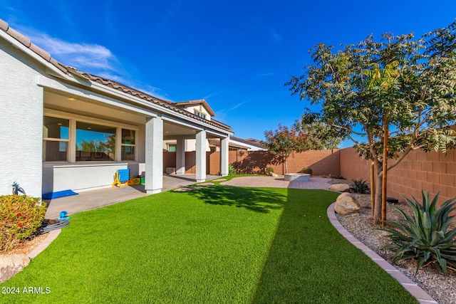 view of yard with a patio area