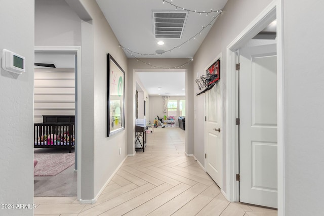 hallway featuring light parquet floors