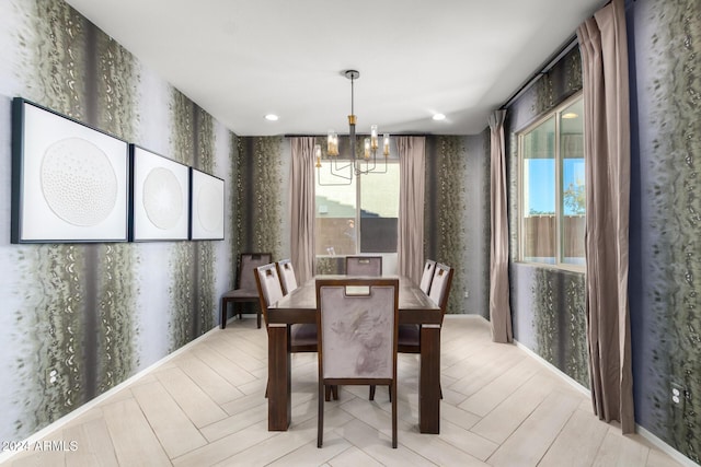 dining room featuring a chandelier and light hardwood / wood-style floors