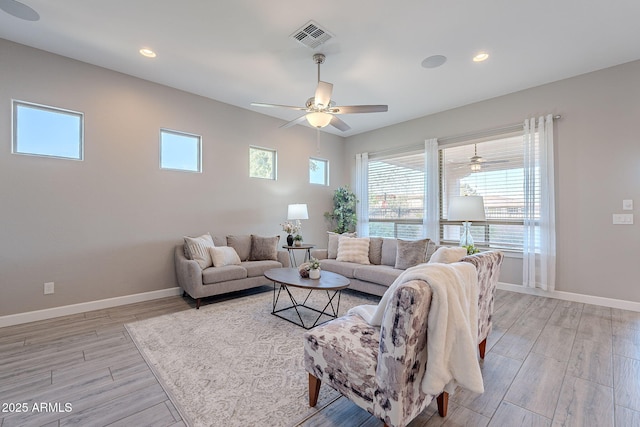 36169 N Serrano Ave, Queen Creek, AZ 85140 - living area with light wood-style floors, visible vents, baseboards, and ceiling fan