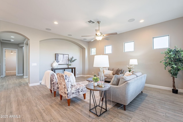 36169 N Serrano Ave, Queen Creek, AZ 85140 - living area with arched walkways, a ceiling fan, visible vents, and light wood-style floors
