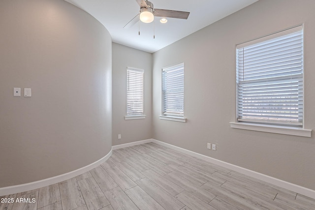 36169 N Serrano Ave, Queen Creek, AZ 85140 - empty room featuring light wood-style floors, ceiling fan, and baseboards