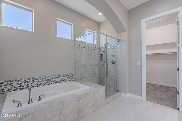 36169 N Serrano Ave, Queen Creek, AZ 85140 - bathroom featuring a stall shower, a garden tub, a walk in closet, and tile patterned floors