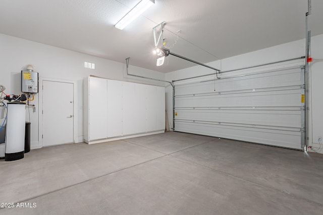36169 N Serrano Ave, Queen Creek, AZ 85140 - garage featuring a garage door opener and tankless water heater