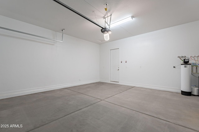 36169 N Serrano Ave, Queen Creek, AZ 85140 - garage with baseboards and a garage door opener