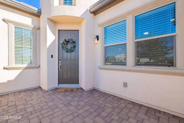 36169 N Serrano Ave, Queen Creek, AZ 85140 - property entrance featuring a patio area and stucco siding