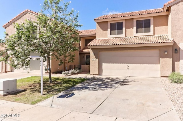 mediterranean / spanish-style house with a garage