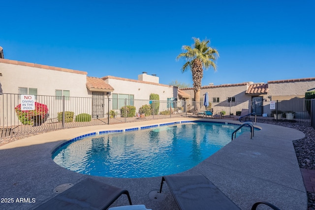 view of swimming pool featuring a patio