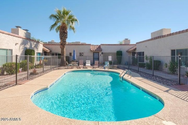 view of swimming pool featuring a patio