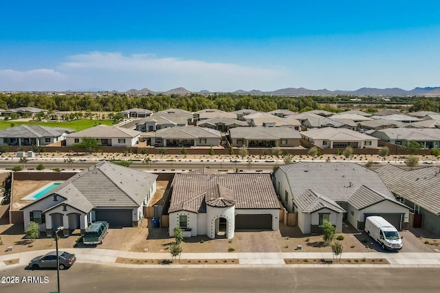 aerial view featuring a mountain view and a residential view