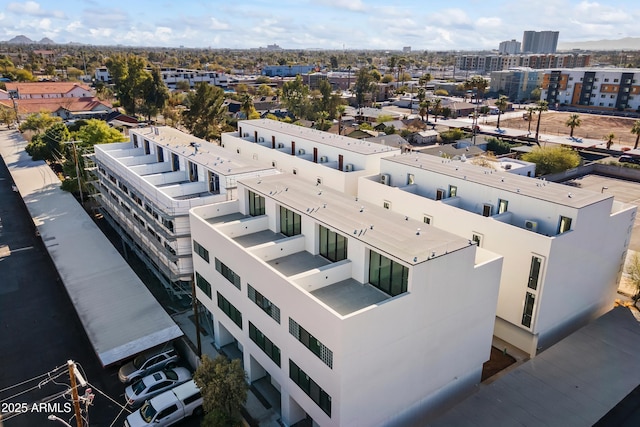 birds eye view of property with a city view