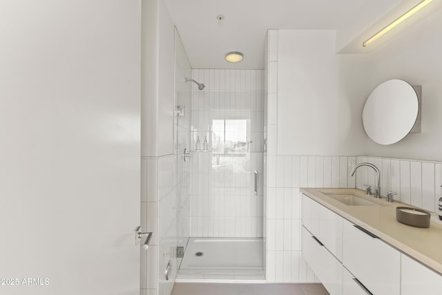 bathroom with vanity and an enclosed shower