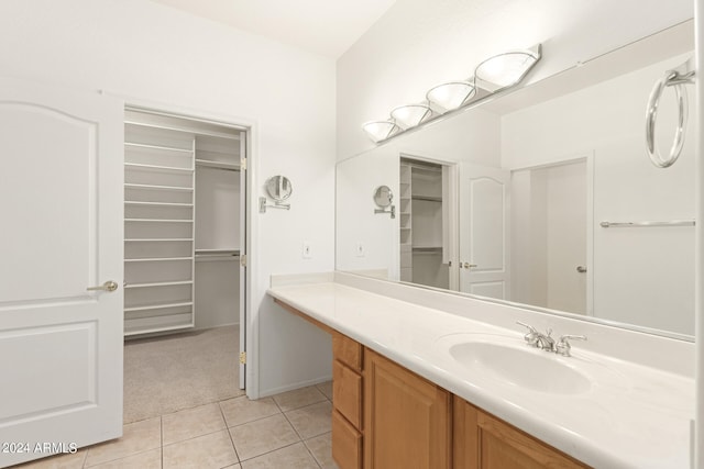 bathroom with tile patterned flooring and vanity