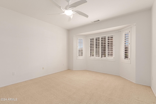 carpeted empty room with ceiling fan