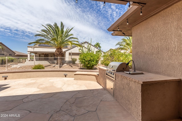 view of patio featuring exterior kitchen and area for grilling