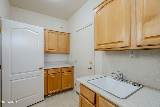 kitchen with light tile patterned flooring and sink