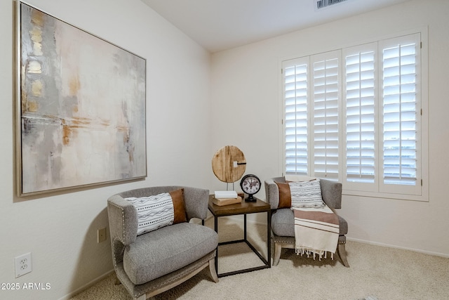 sitting room with carpet flooring