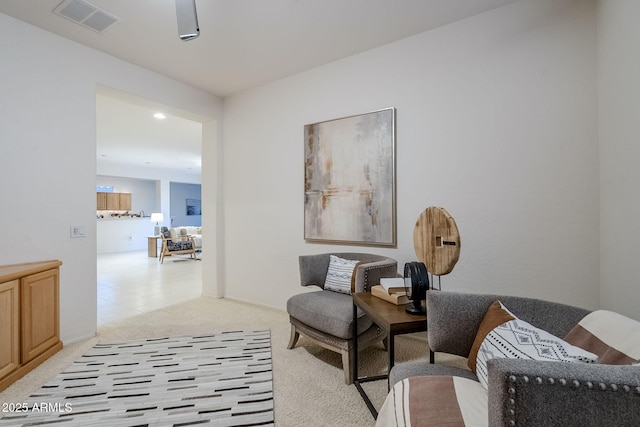 sitting room with light colored carpet