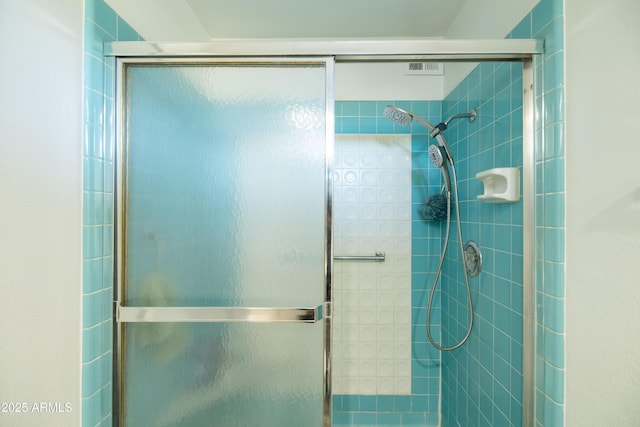 bathroom with a stall shower