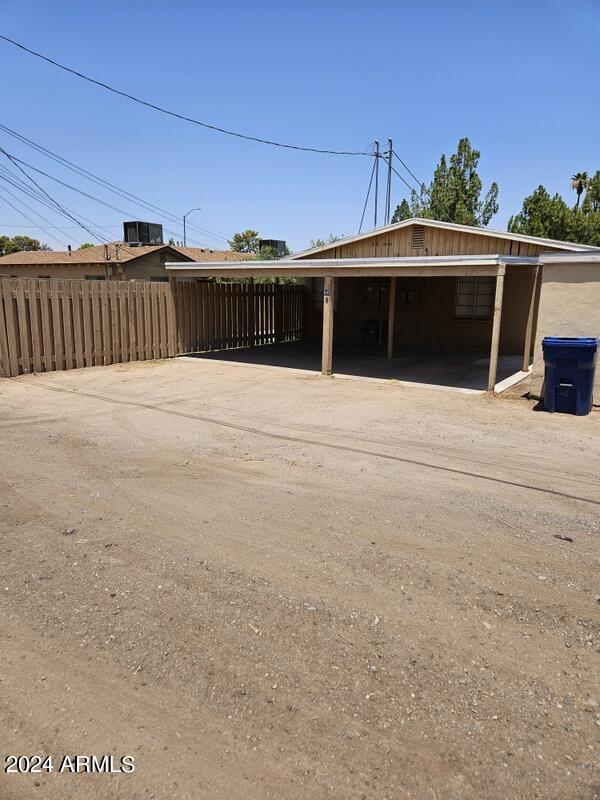 exterior space with a carport