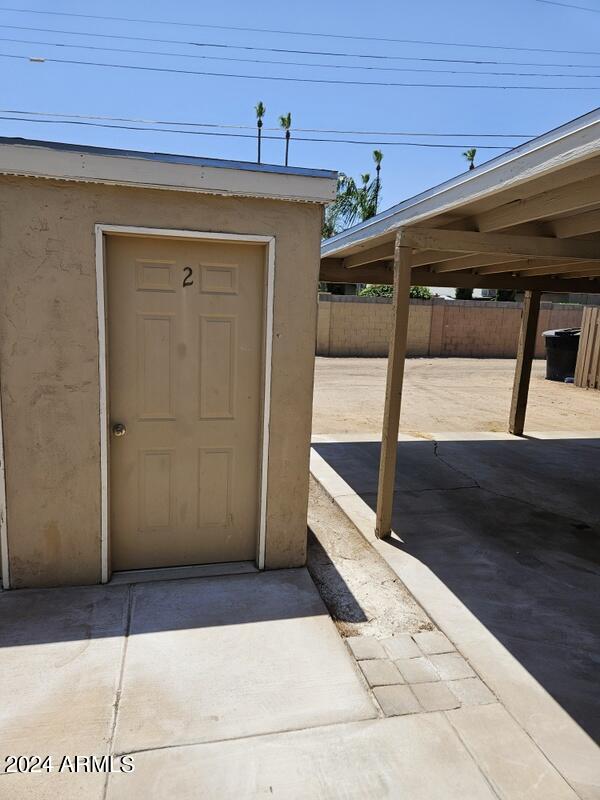 view of exterior entry featuring a patio