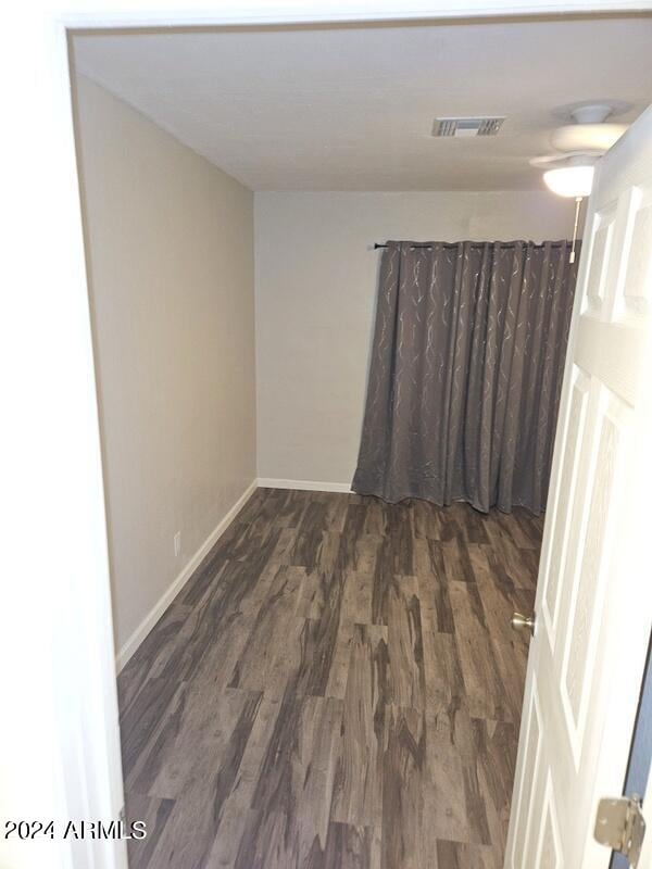 unfurnished room featuring dark hardwood / wood-style floors