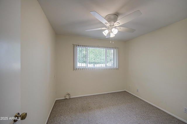 empty room featuring baseboards, a ceiling fan, and carpet