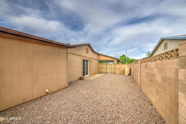 view of yard featuring a patio and a fenced backyard