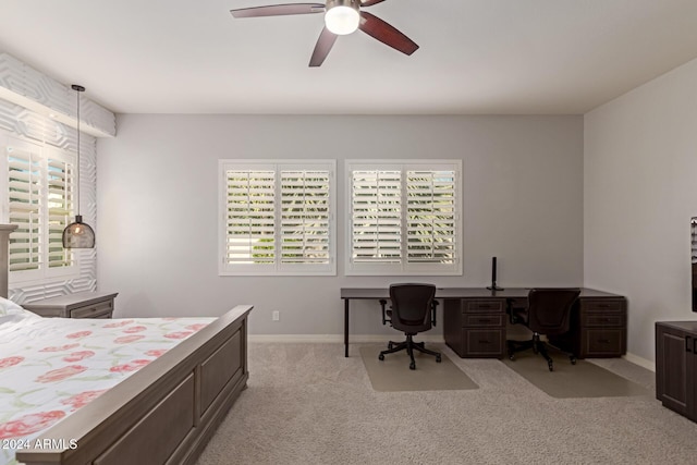 bedroom featuring light colored carpet and ceiling fan