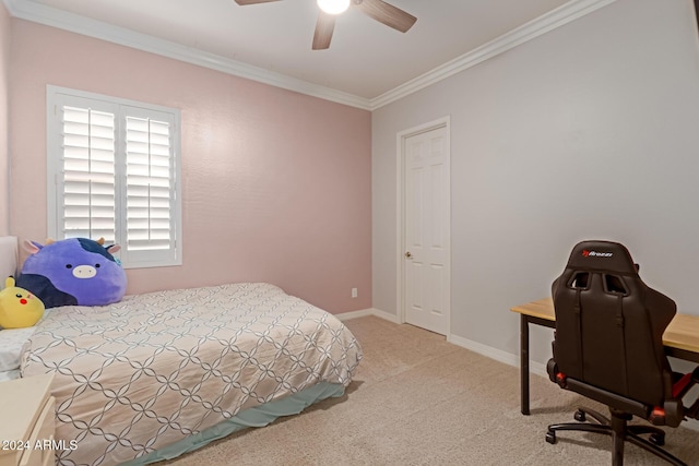 carpeted bedroom featuring ceiling fan and crown molding