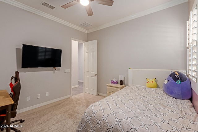 carpeted bedroom featuring ceiling fan and ornamental molding