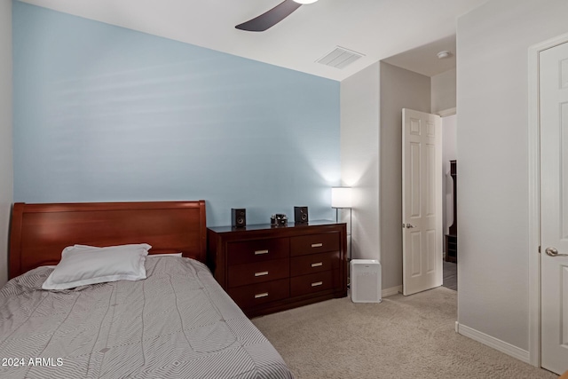 bedroom with ceiling fan and light colored carpet